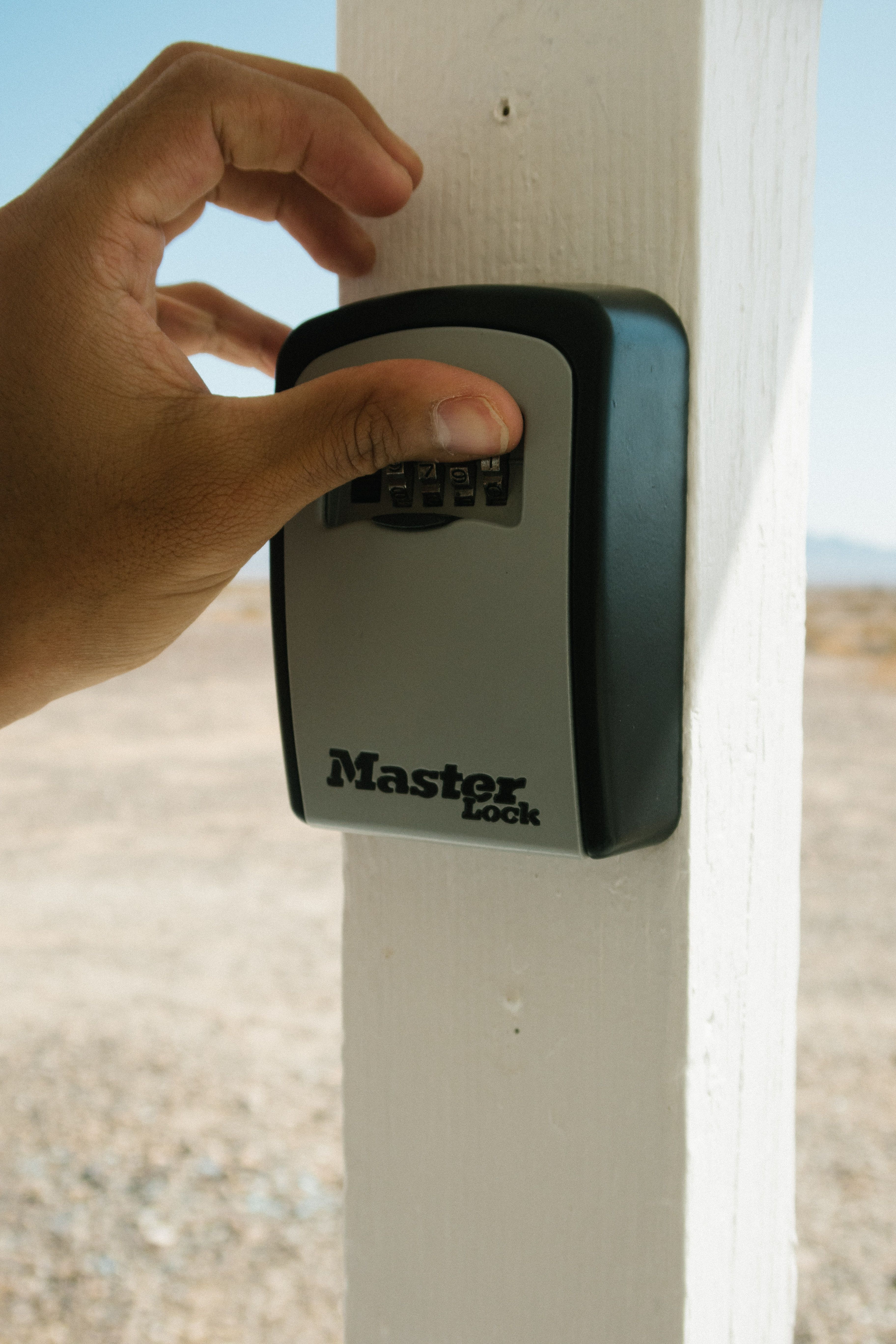 A guest entering a key box code